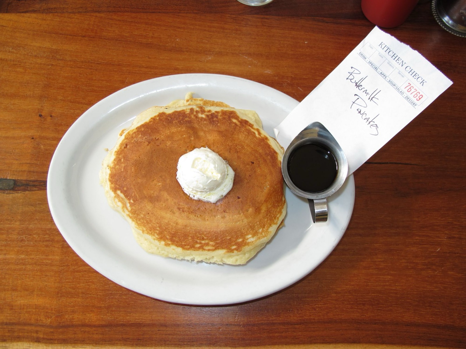 Buttermilk pancakes with whipped butter and syrup